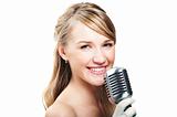 Pretty young girl singing into retro microphone