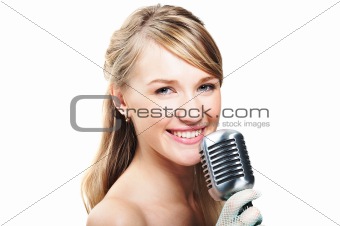 Pretty young girl singing into retro microphone