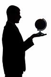 silhouette of man with globe