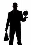 silhouette of man with suitcase and globe