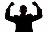 silhouette of man with arms up