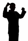 silhouette of man with arms up