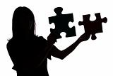 silhouette of woman with puzzle