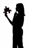 silhouette of woman with puzzle