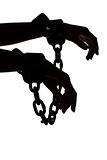 silhouette of woman's hands with chains