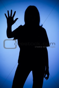 silhouette of woman showing stop