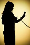 silhouette of woman on the phone