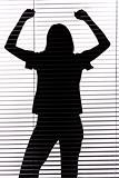 silhouette of woman with hands up (blind)