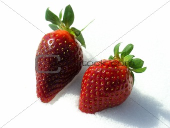 Two Strawberries over the snow.