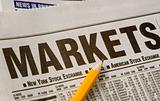 Newspaper with business market results