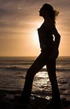 Silhouette of a woman at sunset.