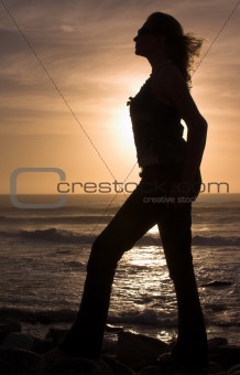Silhouette of a woman at sunset.