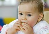 Small baby eating apple