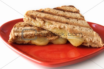 sandwich with melted cheese on heart shape plate
