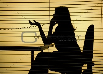 silhouette of woman on the phone 