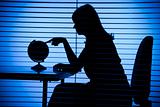 silhouette of woman with globe (office + blind)
