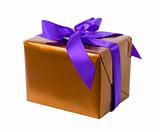 gift - golden paper and purple ribbon