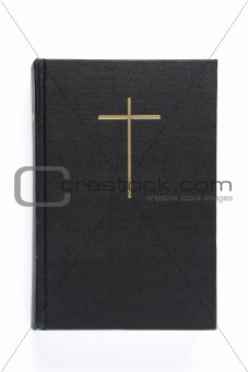 Black bible with cross on the cover