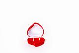 Wedding rings in red heart shaped velvet box 
