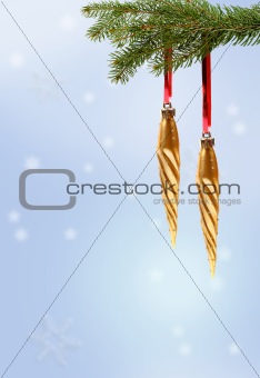 christmas ornament on branch on blue background