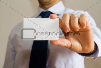 Business man holding a name card
