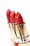 Three tubes of red lipstick