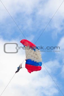 Parachute against cloudy sky