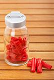 Red licorice on glass jar