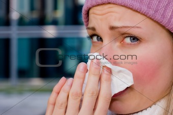 young female having a cold