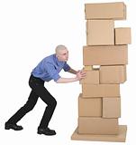 Man pushing pile cardboard boxes