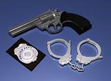 Police badge, gun and handcuffs