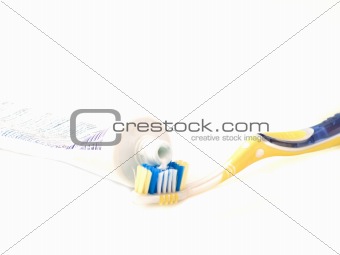 Modern tooth brush and toothpaste isolated on white
