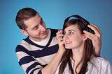 attractive young couple listen to music