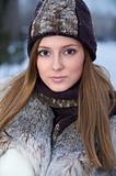 Beautiful young woman in winter fur coat
