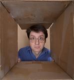 Man portrait inside carton box