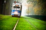 Blue tram number 15 is going on the green grass - Krakow,Poland