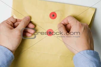 Hand opening confidential envelope