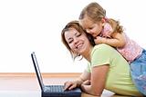 Woman and little girl with laptop