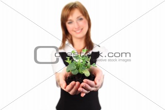 Woman holding a plant