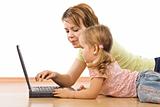 Little girl and woman with laptop