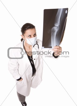female doctor in medical mask looking at xray