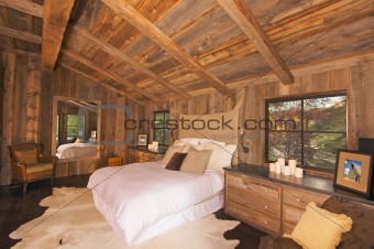 Luxurious Rustic Log Cabin Bedroom in a Rural Setting.