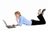 Beautiful businesswoman with laptop lying on the floor