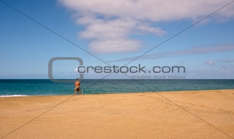 Sea fisherman on an empty beach