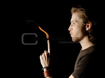 The man blowing off fire