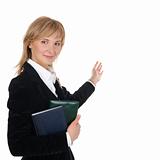 Portrait of businesswoman  pointing at wall 