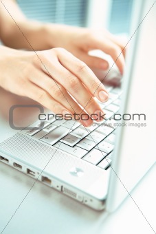 Hand and computer.