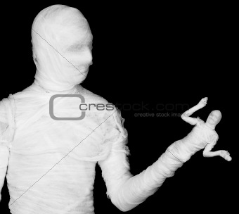 Phantasmagoric mummy - puppeteer on a black
