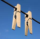 Two wooden clothes-peg