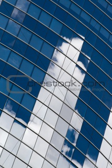 Skyscraper facade with clouds